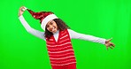 Face, green screen and girl with Christmas outfit, excited and celebration against a studio background. Portrait, young person and female child with Xmas clothes, happiness and cheerful on backdrop