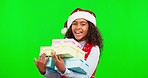 Christmas, green screen and face with girl, presents and happiness against a studio background. Portrait, young person and female child with parcels, Xmas and packages with joy, cheerful and gifts