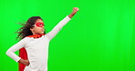 Flying, superhero and children with a girl on a green screen background in studio standing hand on hip. Kids, justice and costume with a female child hero playing fantasy as a crime fighter