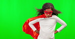 Portrait, superhero and children with a girl on a green screen background in studio standing hands on hips. Kids, justice and costume with a female child hero playing fantasy as a crime fighter