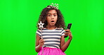 Phone, surprise and a princess girl on a green screen background in studio reading news or gossip. Mobile, wow and wand with an adorable little female child looking shocked on chromakey mockup