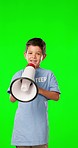 Face, protest and boy with megaphone, green screen and speaking against a studio background. Portrait, male child and young person with microphone, talking and loud speaker for empowerment and space