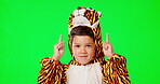 Children, dance and pointing with a boy on a green screen background in studio for marketing or presentation. Portrait, fun and costume with a cute male kid dancing while advertising on chromakey