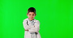 Portrait, kids and a boy doctor on a green screen background in studio for healthcare or insurance. Children, arms crossed and medicine with a male child looking serious about medical treatment