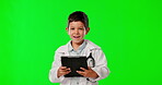 Child doctor, face and tablet with green screen in studio isolated on a background mockup. Portrait, healthcare professional and laughing or funny boy pretending with touchscreen technology online.