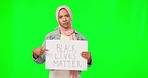 Muslim, woman and paper board by green screen with face, hands and pointing at opinion for human rights. Young islamic girl, poster and fight for african people in mock up portrait by background