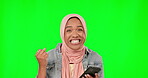 Green screen, phone and woman winning, success or cheers for muslim prize or bonus, wow and yes mockup.  Face of islamic person, winner on cellphone news and fist pump, isolated on studio background