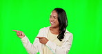 Branding, pointing and a woman on a green screen background in studio for marketing or advertising. Portrait, smile or hand gesture with a happy female on chromakey mockup space for product placement