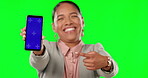 Portrait, mockup and a business woman pointing to a phone with tracking markers for marketing. Social media, ecommerce and green screen with an female employee showing a mobile screen or display