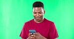 Phone, texting and black man on green screen studio thinking, chatting and browsing against mockup background. Social media, streaming and guy search, internet and online for website communication