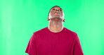 Phone, bad news and disappointment with a frustrated black man in studio on a green screen background. Social media, mobile and an unhappy male reading a negative text message on chromakey mockup