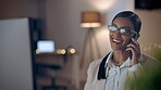 Phone call, computer and a designer woman in her office at night, working to complete a project by deadline. Mobile, communication and design with a female employee at work in a creative agency