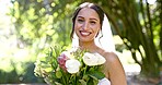 Happy bride, face and flower bouquet outdoor for celebration in garden, summer and marriage. Portrait of woman, wedding day and holding roses, flowers and floral blossom to celebrate love at event 