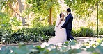 Wedding, funny and married couple playing at marriage event celebrating love in nature together feeling happy. Excited, bride and groom celebrate commitment or romantic ceremony of a man and woman