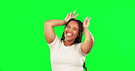 Face, green screen and woman with bunny ears, funny and happy girl against a studio background. Portrait, female person and model with a smile, goofy and silly with gesture for rabbit, joke and humor