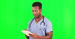 Black man, doctor and tablet on green screen, health and digital results and mockup on studio background. Male surgeon typing, tech and healthcare medicine, online or electronic hospital schedule