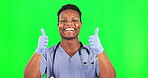 Black man, happy doctor and thumbs up on green screen, health with positive opinion and mockup space on studio background. Male surgeon smile, portrait and healthcare with agreement and emoji