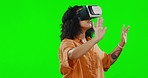 VR, games and a woman with glasses on a green screen isolated on a studio background. Interactive, feeling and a girl in a metaverse for gaming, virtual reality entertainment and fantasy tech