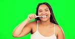 Green screen, face and happy woman brushing teeth in studio for healthy dental wellness. Portrait of female model, toothbrush and cleaning mouth for fresh breath, oral maintenance and care of smile