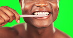 Black man, mouth and toothbrush, brushing teeth on green screen with hygiene and oral health for dental care. Happy male, closeup and morning routine with cleaning and grooming on studio background