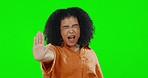 Stop, angry and face of a woman on a green screen isolated on a studio background. Frustrated, anger and portrait of a girl with a hand gesture for rejection, decline and disagreement on a backdrop