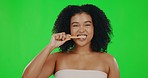 Black woman with smile on green screen, brushing teeth and dental, health with oral care tools. Female is happy, mouth hygiene and portrait, mockup with whitening and toothbrush on studio background