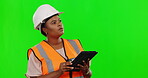 Black woman, architect and tablet on green screen for construction, planning or strategy against a studio background. African female contractor, engineer or builder working on technology on mockup