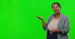 Presentation, face and woman in a studio with green screen with mockup space for advertising. Presenter, talking and portrait of an African female model pointing to mock up by chroma key background.