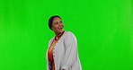 Happy, looking and a black woman walking on a green screen isolated on a studio background. Smile, impressed and an African lady smiling, reacting and admiring chromakey mockup space on a backdrop