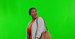 Looking, happy and a black woman on a green screen exploring isolated on a studio background. Excited, smile and an African lady walking and admiring mockup space on a backdrop with happiness