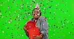 Black woman, gift and confetti with party on green screen, excited about surprise with mockup space and happiness. Happy female, birthday and present box, celebration and festive on studio background
