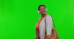 Green screen, smile and black woman walking, headphones and streaming music against studio background. Female, model and  happy person with headset, radio and listening to sounds, audio and happiness