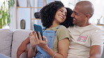 Phone, couple and smile on sofa in living room of home, social media or online browsing. Love, cellphone and happiness of man and woman on couch web scrolling, relaxing or streaming video together.