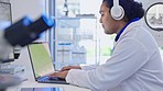 Science, laptop and man with headphones in laboratory listen to music, audio and dance to radio. Healthcare, biotechnology and male scientist on computer for medical research, analysis and working