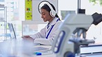 Science, laptop and Indian woman with headphones in laboratory listen to music, audio and radio. Healthcare, biotechnology and female scientist on computer for medical research, analysis and working