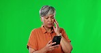 Senior woman, phone scam and green screen with a frustrated female with spam. Isolated, studio background and mobile glitch with an elderly person feeling confused from internet email problem