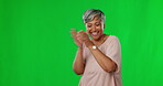 Dancing, green screen and happy or excited woman dance in celebration after winning isolated in a studio background. Winner, celebrate and mature female with a positive energy for bonus or good news