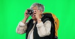 Photography, camera and excited, woman on green screen and travel adventure photographer with backpack. Art, hobby and mockup space, mature tourist taking picture on international holiday or vacation