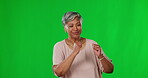 Dance, green screen and happy mature woman dancing in celebration after winning isolated in a studio background. Winner, celebrate and female with a positive energy for bonus or good news