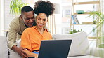 Laptop, couple smile and relax in home living room, bonding and online shopping on sofa. Interracial, computer and happy black man and woman on social media, internet browsing or streaming video.