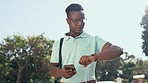 Phone, time and business black man in city waiting for lift, taxi service and transport typing on smartphone. Communication, network and male worker check watch for planning, schedule and commute