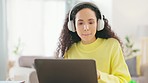 Woman, headphones and living room in a home with a female student listening to music. Remote work, audio streaming and young person in a house feeling calm with a smile and hearing internet radio