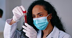 Face mask, blood test and scientist in laboratory for vaccine research analysis, science exam or healthcare check. Doctor or medical woman with test tube for covid 19, dna or red liquid for solution