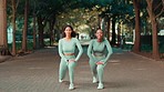 Fitness, nature and women stretching their legs before a run for marathon or race training in a park. Health, sports and portrait of female athletes doing warm up exercise for outdoor cardio workout.