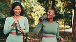 Fitness, drinking water and friends with women in park for running, training and bonding. Relax, happy and break with female runner and toast with bottle in nature for workout, exercise and wellness