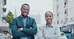 Collaboration, happy and business people in the city, arms crossed on their morning commute to work. Portrait, smile or professionalism with a black and woman employee team standing in an urban town