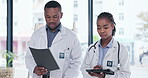 Documents, black people and doctors talking of hospital digital management, report or advice of manager for internship. Walking, tablet and medical professional woman with expert or mentor planning