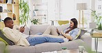 Love, relax and couple on couch, technology and happiness in living room, calm and social media. Partners, black man and woman on sofa, smartphone and tablet for online reading, texting and chatting