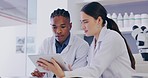 Science, digital tablet and colleagues doing research in a lab for a experiment, innovation or project. Discussion, biology and professional scientists working with biotechnology in a laboratory.