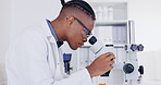 Science, microscope and breakthrough with a doctor man at work in a laboratory for innovation or research. Medical, sample and zoom with an african male scientist working in a lab for an experiment